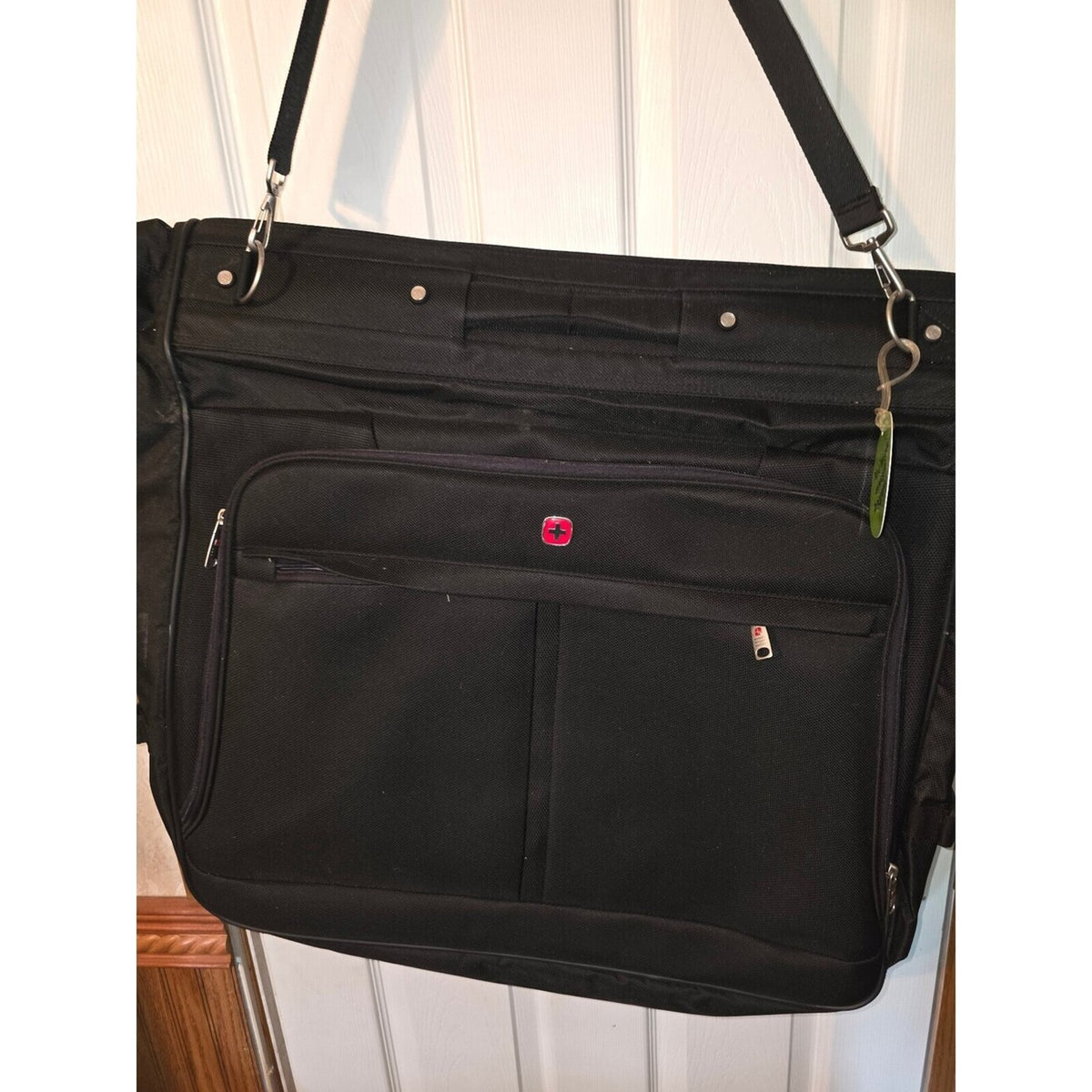 Black garment bag with shoulder strap