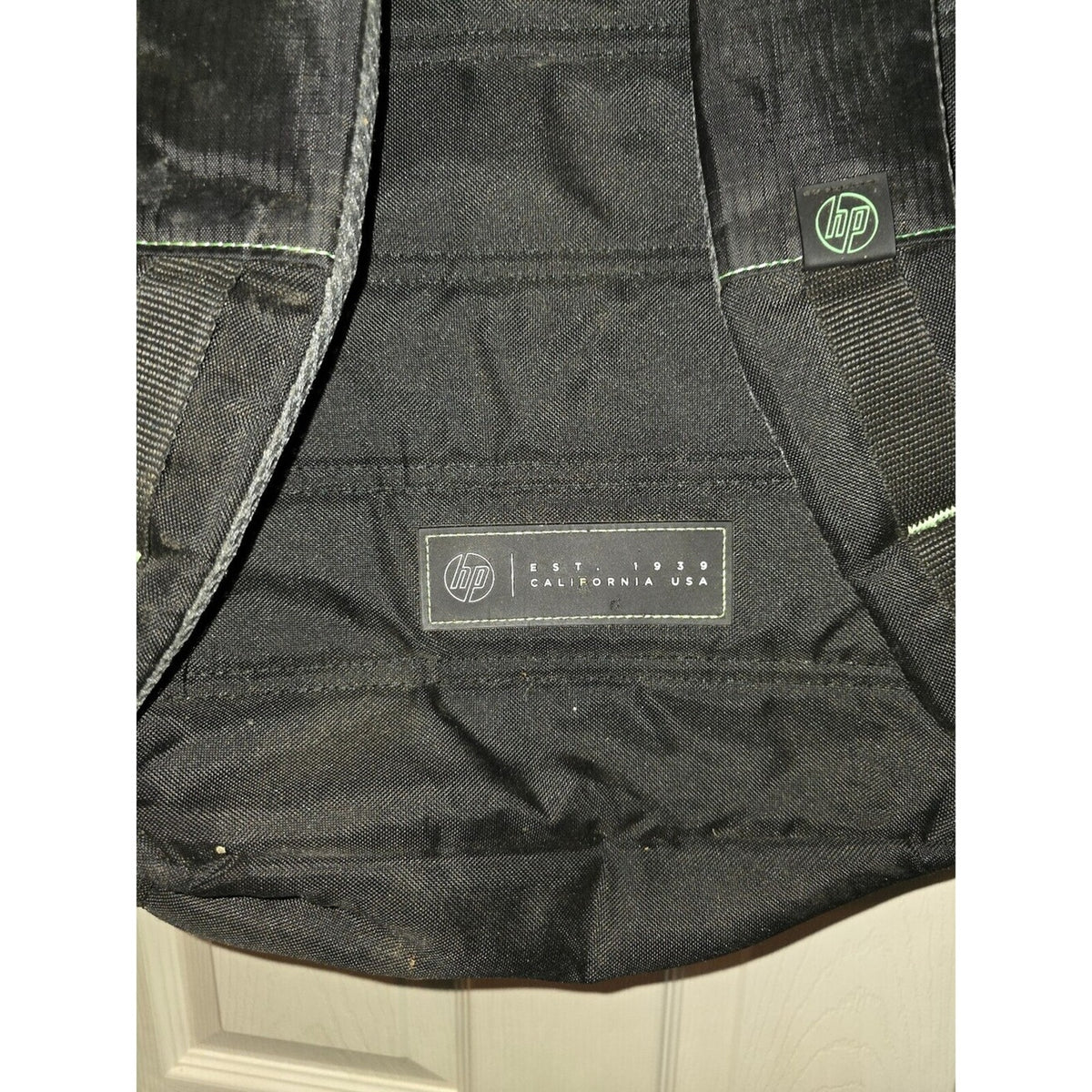 HP Black backpack with green lining