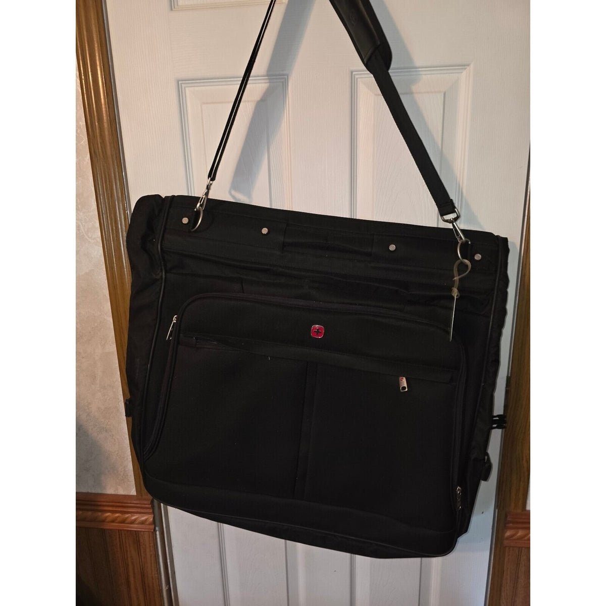 Black garment bag with shoulder strap