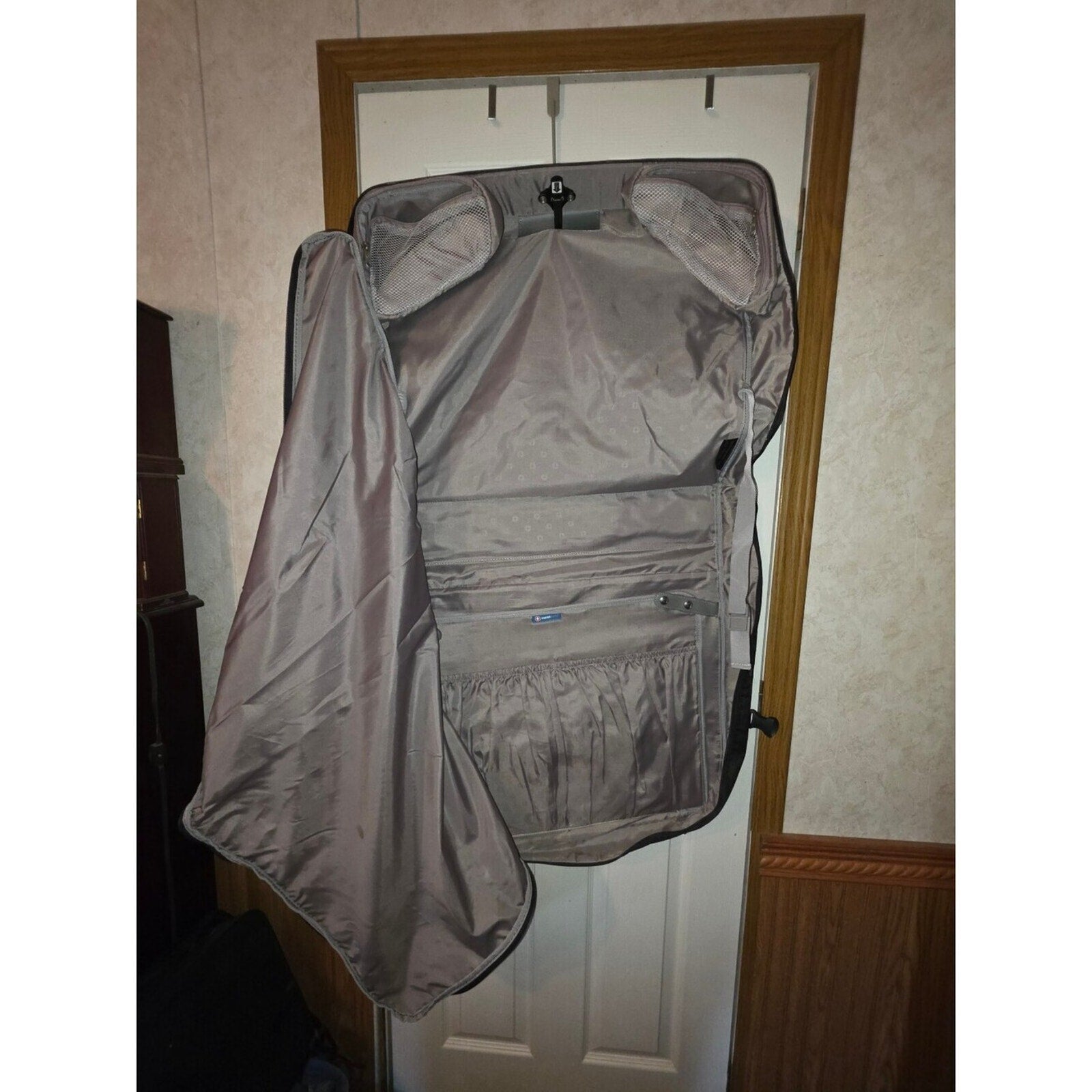 Black garment bag with shoulder strap