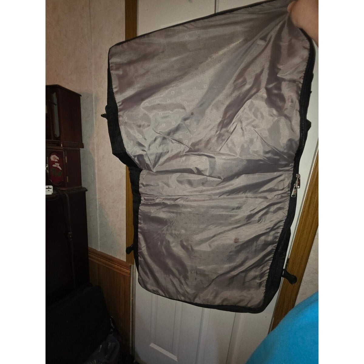 Black garment bag with shoulder strap